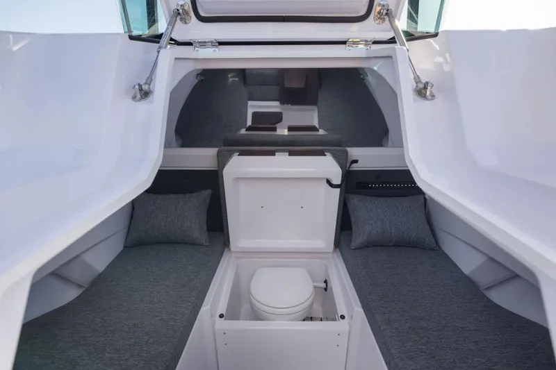 Slide: The Image of Interior of 2027 Axopar 29 XC Cross Cabin, featuring compact cabin space and seating. - 13