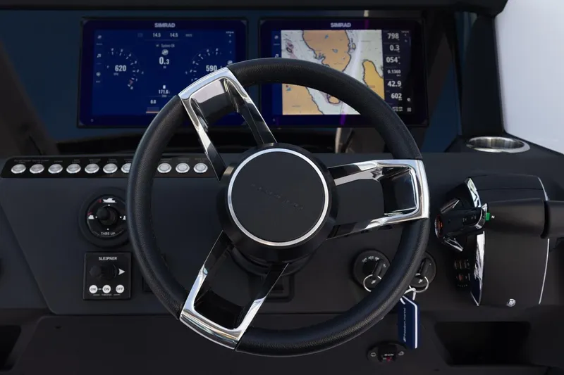 Slide: The Image of Steering wheel and dashboard of 2027 Axopar 29 XC Cross Cabin boat. - 12