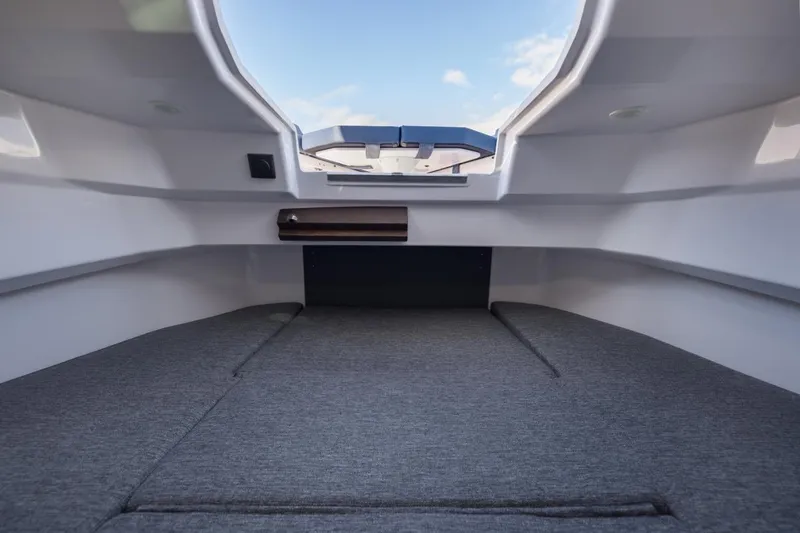 Slide: The Image of Interior cabin view of 2027 Axopar 29 XC Cross Cabin boat, featuring sleek design and comfortable seating. - 14