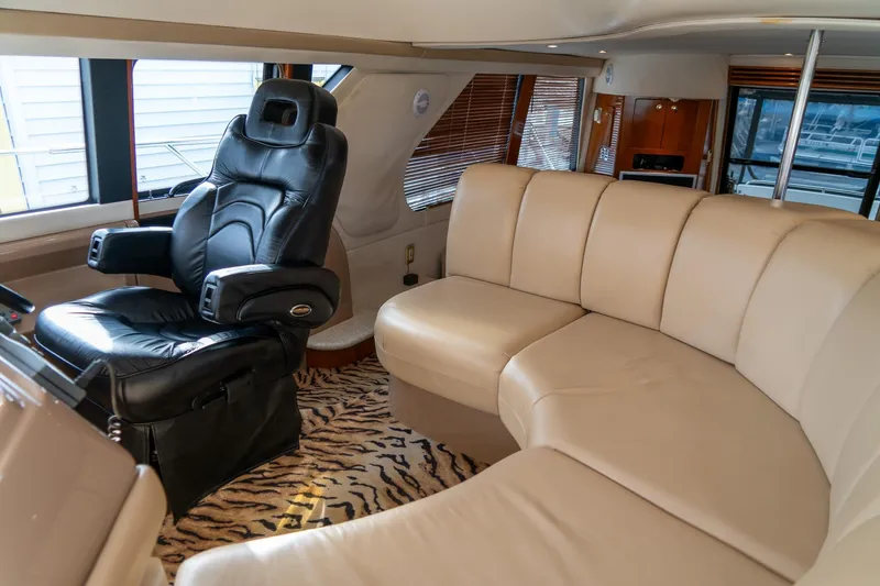 Slide: The Image of Luxurious interior of 2000 Carver 450 Voyager Pilothouse with leather seating and captain's chair. - 41