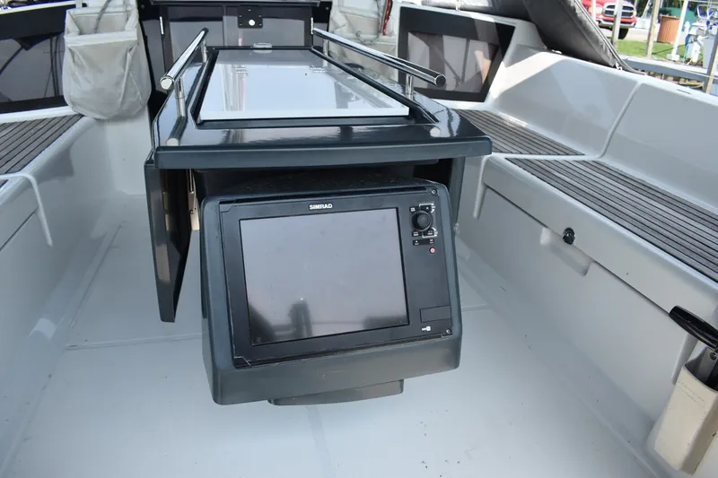 Slide: The Image of Cockpit of 2012 Beneteau Oceanis 41.1 with navigation equipment and seating. - 12