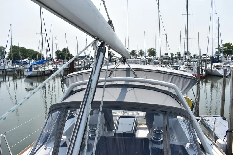 Slide: The Image of Beneteau Oceanis 41.1 sailboat docked in a marina, 2012 model, with visible rigging and canopy. - 27