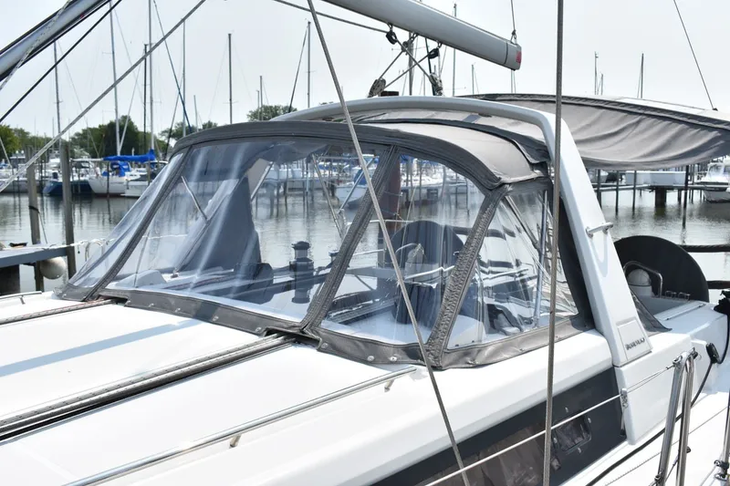 Slide: The Image of Beneteau Oceanis 41.1 sailboat, 2012 model, docked in a marina with clear canopy. - 29