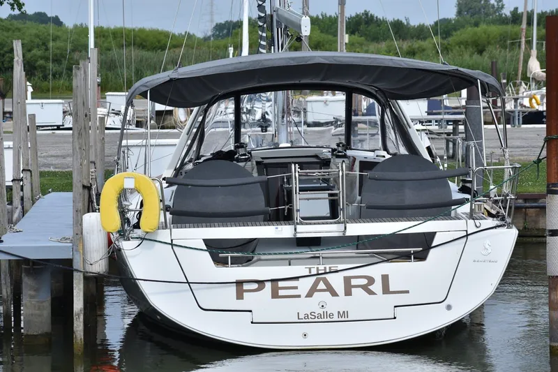 Slide: The Image of 2012 Beneteau Oceanis 41.1 sailboat docked, rear view, named "The Pearl," LaSalle MI. - 61