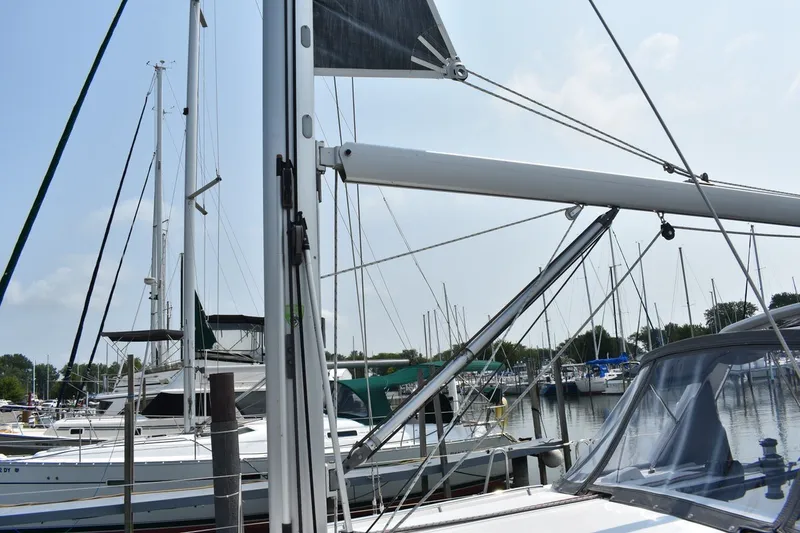 Slide: The Image of Beneteau Oceanis 41.1 sailboat docked at marina, 2012 model, with masts and rigging visible. - 30