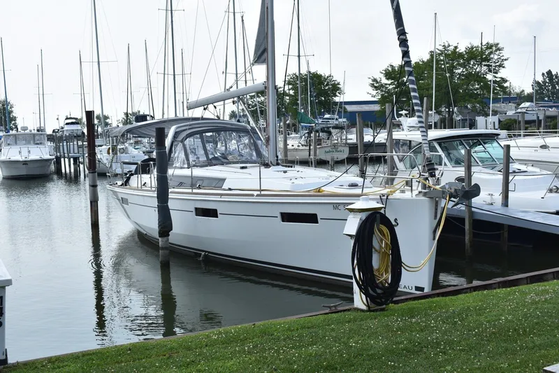 Slide: The Image of Beneteau Oceanis 41.1 sailboat docked at marina, 2012 model, surrounded by other boats. - 3