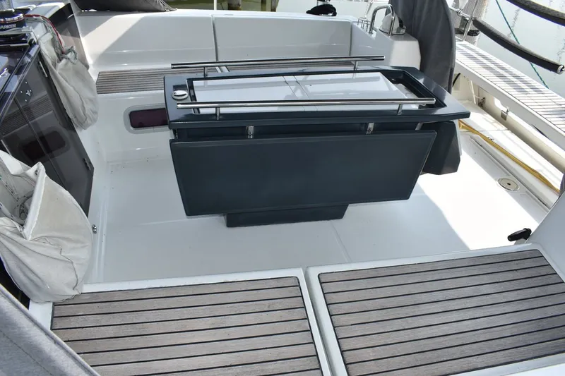 Slide: The Image of Cockpit of 2012 Beneteau Oceanis 41.1 sailboat with foldable table and teak flooring. - 33