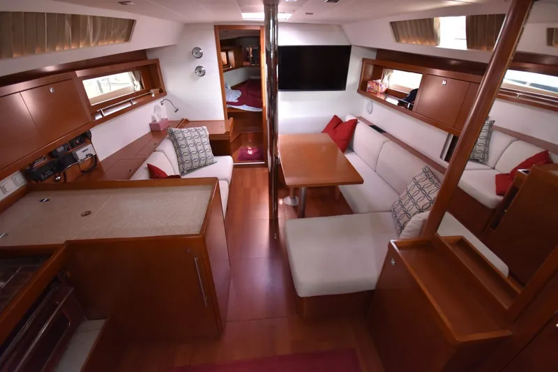 Slide: The Image of Luxurious interior of 2012 Beneteau Oceanis 41.1 yacht with elegant wood finish and cozy seating. - 36