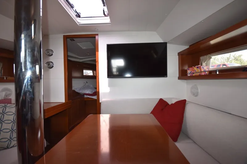 Slide: The Image of Interior of 2012 Beneteau Oceanis 41.1 yacht with cozy seating and modern amenities. - 38