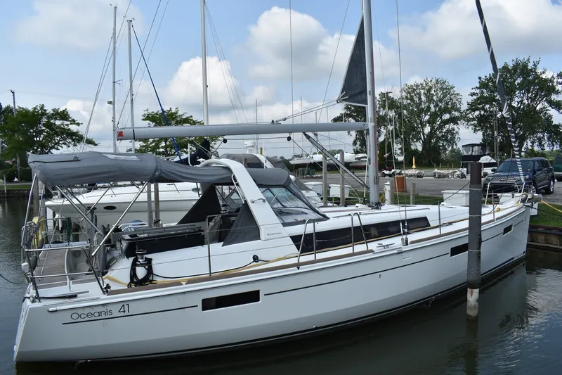 Slide: The Image of 2012 Beneteau Oceanis 41.1 sailboat docked at marina, featuring sleek design and spacious deck. - 4