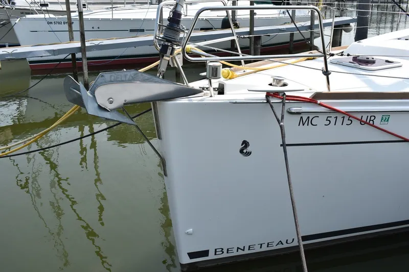 Slide: The Image of Beneteau Oceanis 41.1 sailboat, 2012 model, docked with visible anchor and registration number. - 6