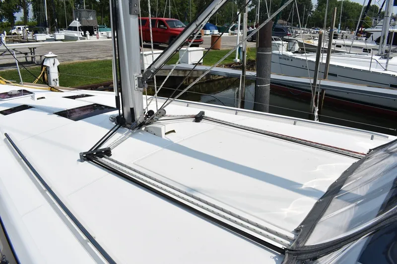 Slide: The Image of Deck view of a 2012 Beneteau Oceanis 41.1 sailboat docked at a marina. - 20