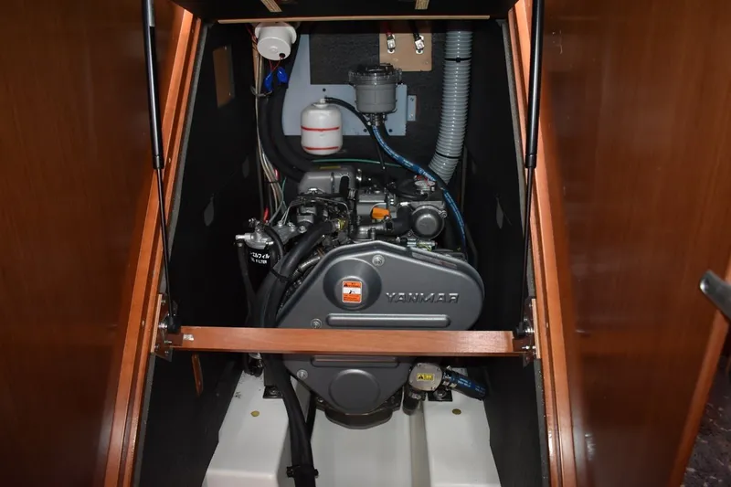Slide: The Image of Engine compartment of a 2012 Beneteau Oceanis 41.1 sailboat, featuring a Yanmar engine. - 58