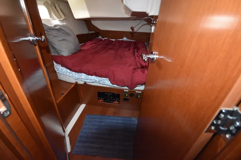 Slide: The Image of Cozy cabin interior of 2012 Beneteau Oceanis 41.1 sailboat with red bedding. - 51