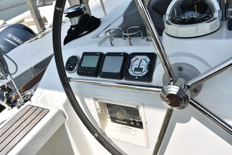 Slide: The Image of Steering wheel and navigation instruments on a 2012 Beneteau Oceanis 41.1 sailboat. - 9