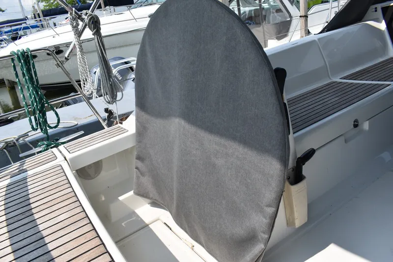 Slide: The Image of Beneteau Oceanis 41.1 cockpit with covered steering wheel, showcasing teak decking, 2012 model. - 7