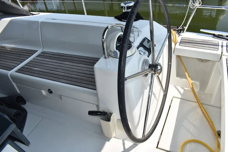 Slide: The Image of Cockpit of 2012 Beneteau Oceanis 41.1 sailboat with steering wheel and seating. - 11