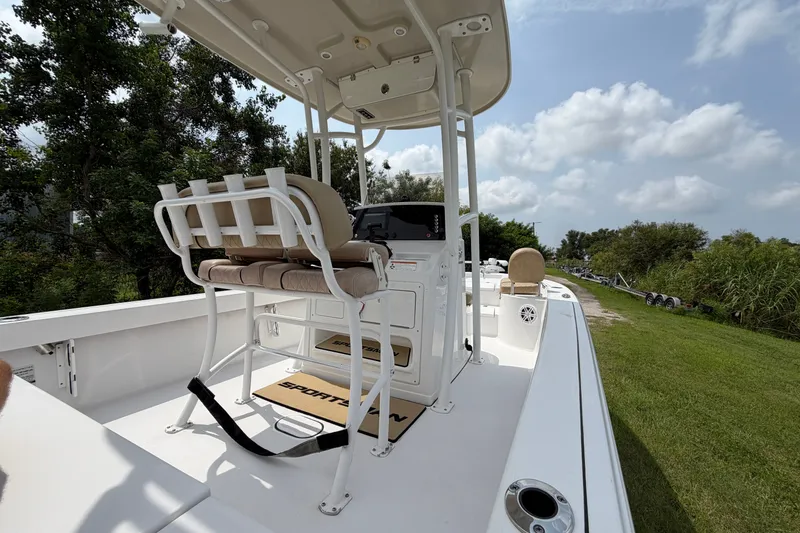 Slide: The Image of 2019 Sportsman Masters 227 Bay Boat on grassy area, featuring seating and console. - 12