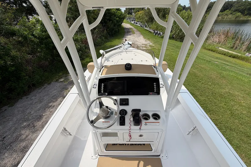 Slide: The Image of 2019 Sportsman Masters 227 Bay Boat cockpit with steering wheel and control panel. - 7