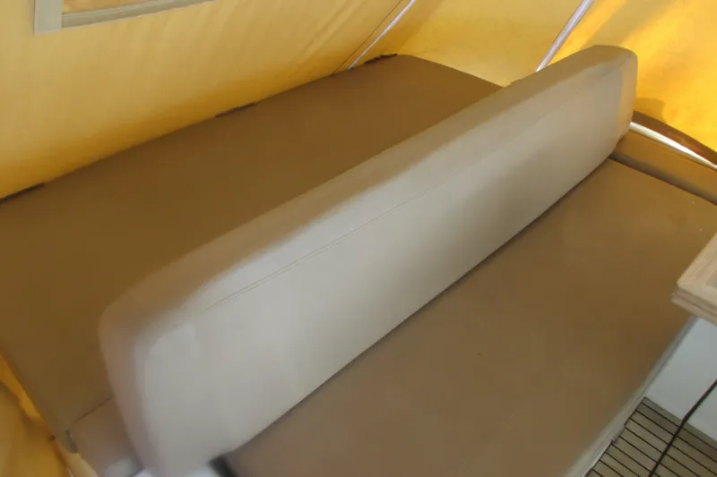 Slide: The Image of Interior seating of 2016 Jeanneau Leader 36 boat with beige upholstery. - 12