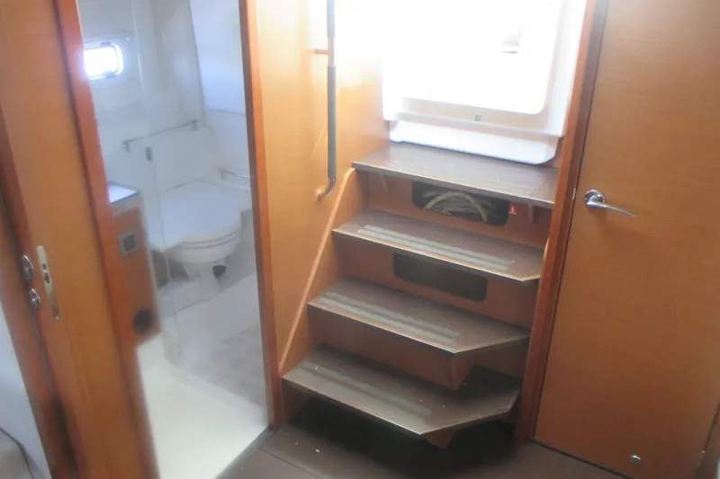 Slide: The Image of Interior of 2016 Jeanneau Leader 36 yacht, featuring stairs and a compact bathroom. - 25