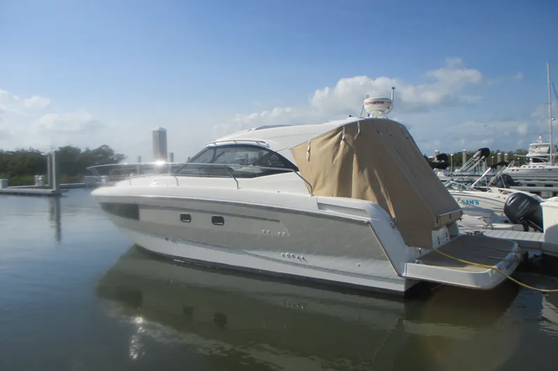 Slide: The Image of 2016 Jeanneau Leader 36 yacht docked at marina under clear blue sky. - 1