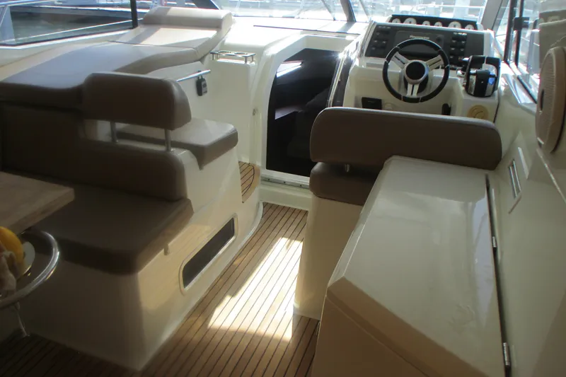 Slide: The Image of Interior of 2016 Jeanneau Leader 36 yacht with helm and seating area. - 10