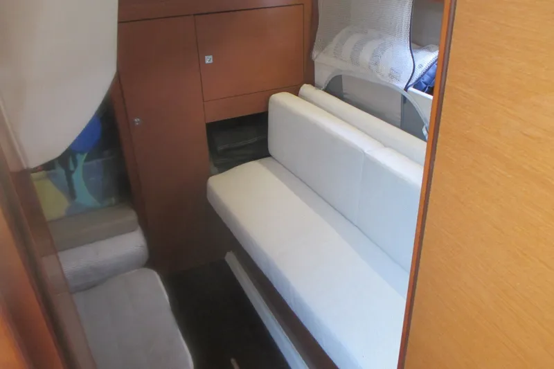 Slide: The Image of Interior cabin of 2016 Jeanneau Leader 36 yacht with white seating and wooden cabinetry. - 28