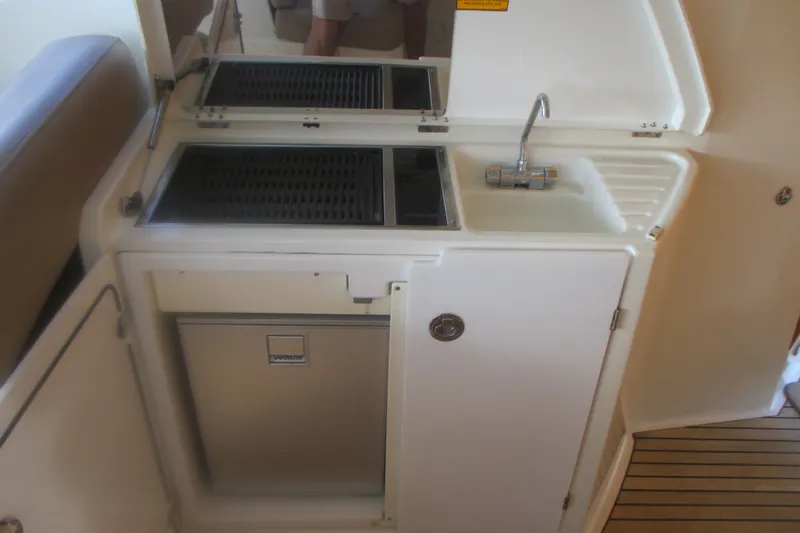 Slide: The Image of Compact kitchenette on 2016 Jeanneau Leader 36 yacht with sink and grill. - 14