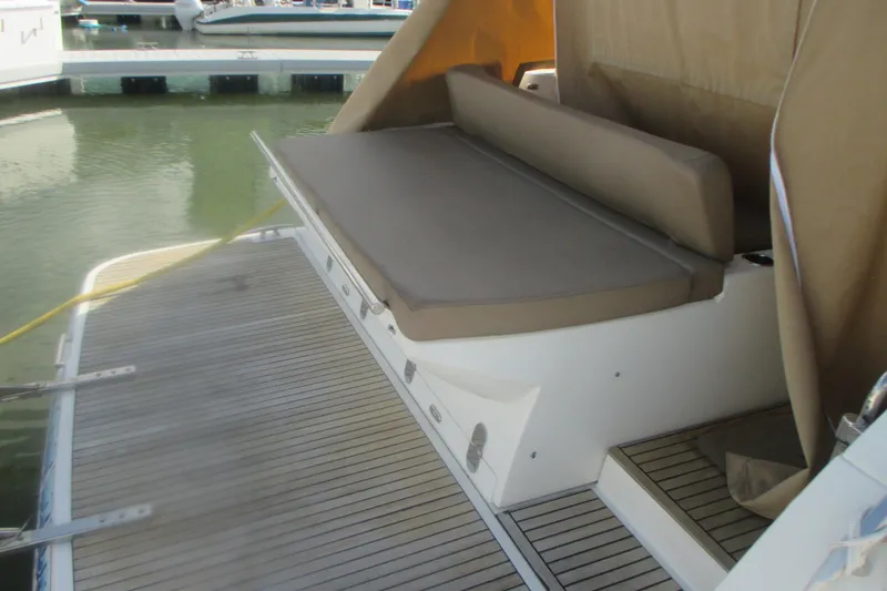 Slide: The Image of 2016 Jeanneau Leader 36 boat with cushioned seating and teak deck at marina. - 9