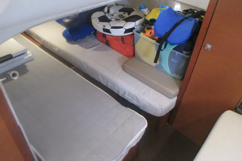 Slide: The Image of Interior cabin of 2016 Jeanneau Leader 36 with storage and bedding. - 30