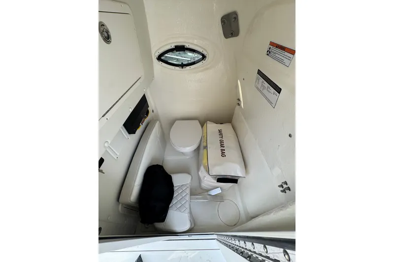 Slide: The Image of Interior of 2026 World Cat 295 CC boat with safety gear bag and seating. - 10