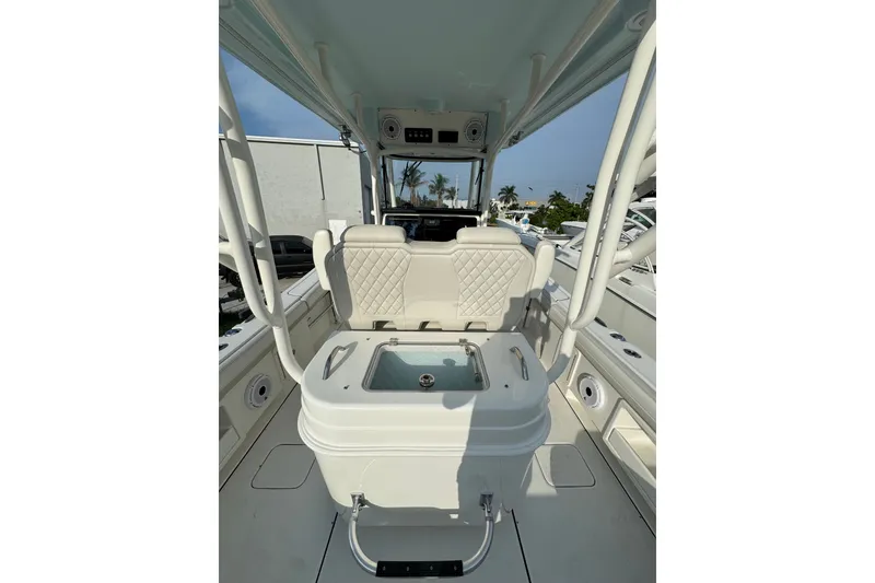 Slide: The Image of 2026 World Cat 295 CC boat interior with seating and storage, showcasing modern design. - 7