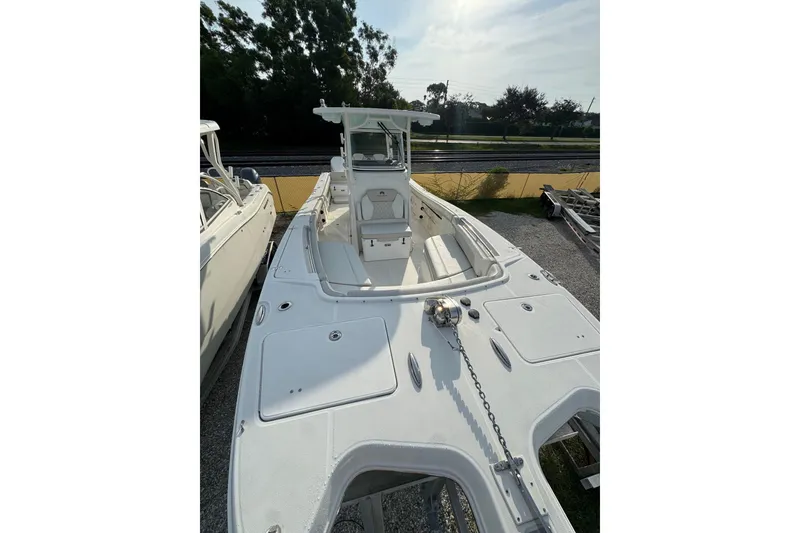 Slide: The Image of 2026 World Cat 295 CC boat with spacious deck and modern design. - 4