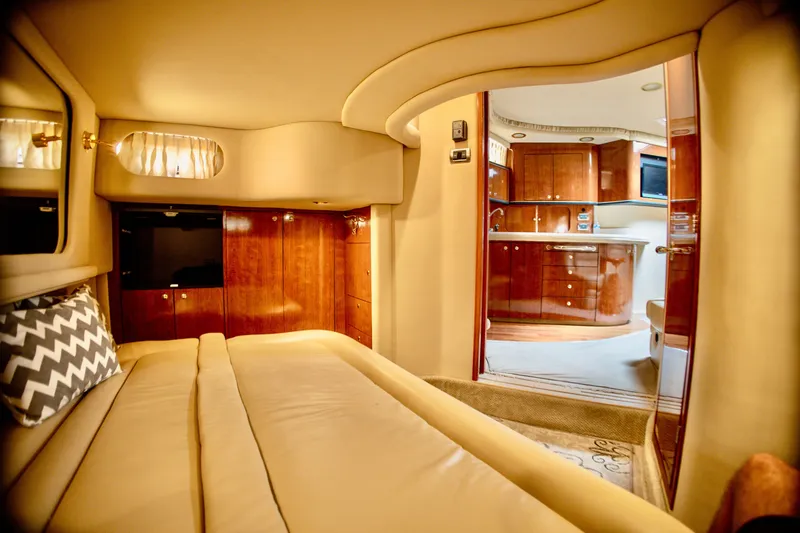 Slide: The Image of Luxurious interior of a 2003 Sea Ray Sundancer 460 with elegant wood accents and comfortable seating. - 24