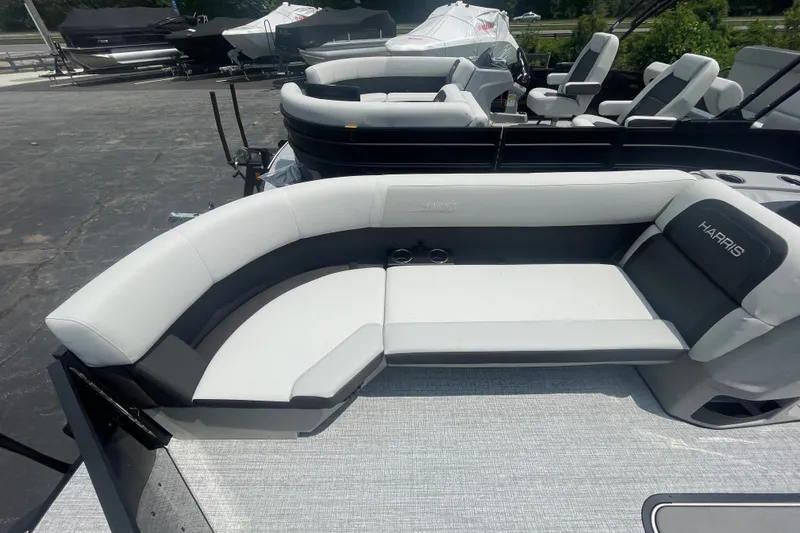 Slide: The Image of 2026 Harris Cruiser 230 SLDH pontoon boat with sleek seating and modern design. - 6