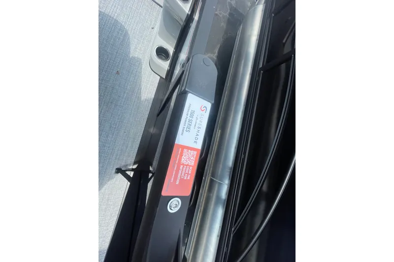 Slide: The Image of 2026 Harris Cruiser 230 SLDH pontoon boat detail with SureShade label and QR code. - 16