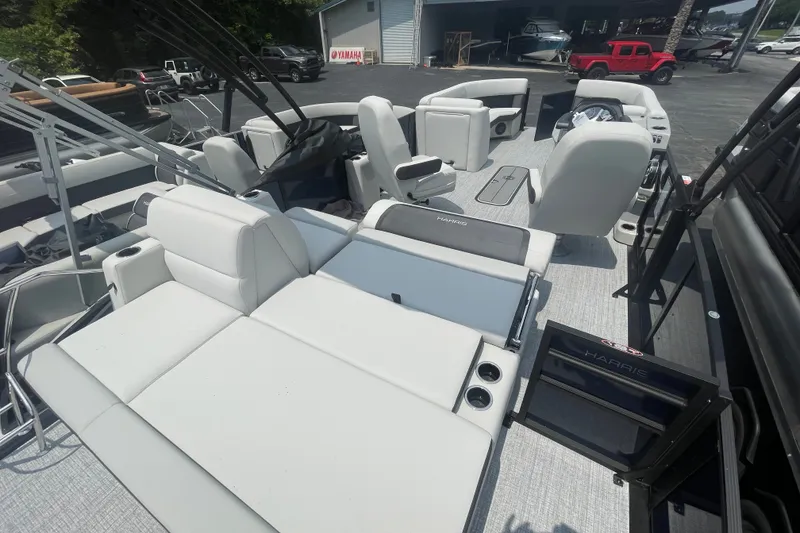 Slide: The Image of 2026 Harris Cruiser 230 SLDH pontoon boat with spacious seating and modern design. - 13