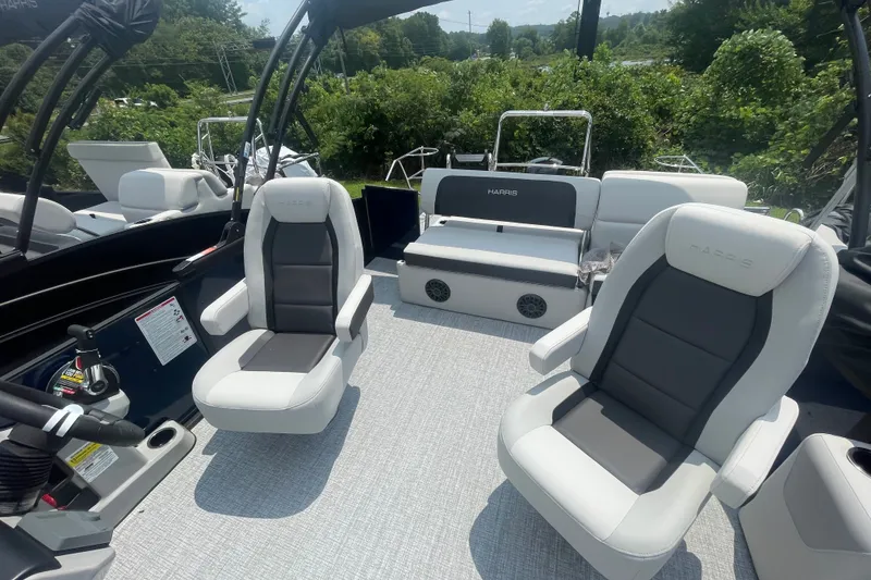 Slide: The Image of 2026 Harris Cruiser 230 SLDH boat interior with plush seating and modern design. - 8