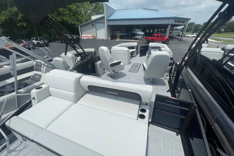 Slide: The Image of 2026 Harris Cruiser 230 SLDH pontoon boat with spacious seating and modern design. - 11