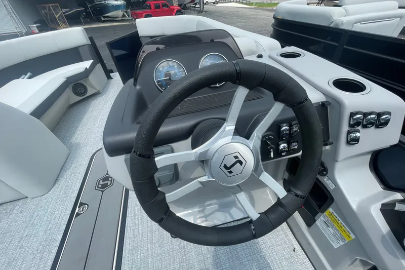 Slide: The Image of Steering wheel and dashboard of 2026 Harris Cruiser 230 SLDH boat. - 17