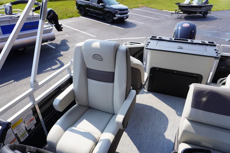 Slide: The Image of 2027 Sun Tracker Fishin' Barge 20 DLX interior with comfortable seating and modern design. - 12