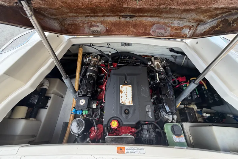 Slide: The Image of Engine compartment of a 2005 Chris-Craft Corsair 25 boat, showcasing detailed components. - 60