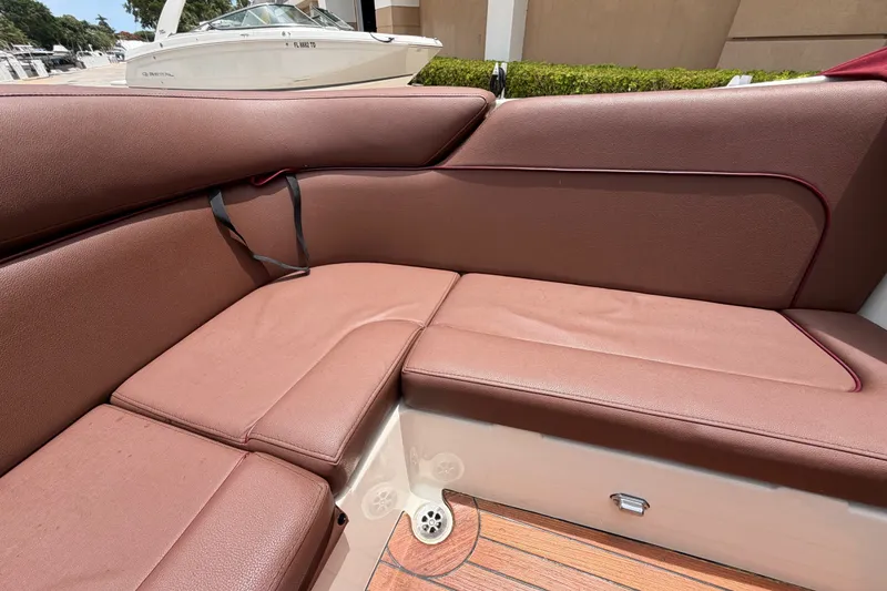 Slide: The Image of Luxurious brown seating on a 2005 Chris-Craft Corsair 25 boat, showcasing elegant design. - 25