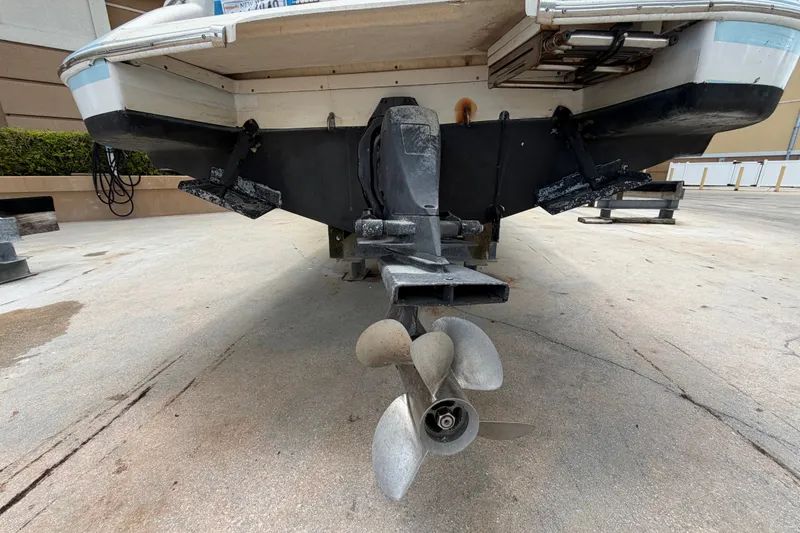 Slide: The Image of Rear view of a 2005 Chris-Craft Corsair 25 boat showing the propeller and stern details. - 15
