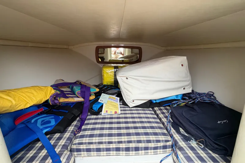 Slide: The Image of Interior cabin of 2005 Chris-Craft Corsair 25 with stored boating gear. - 47