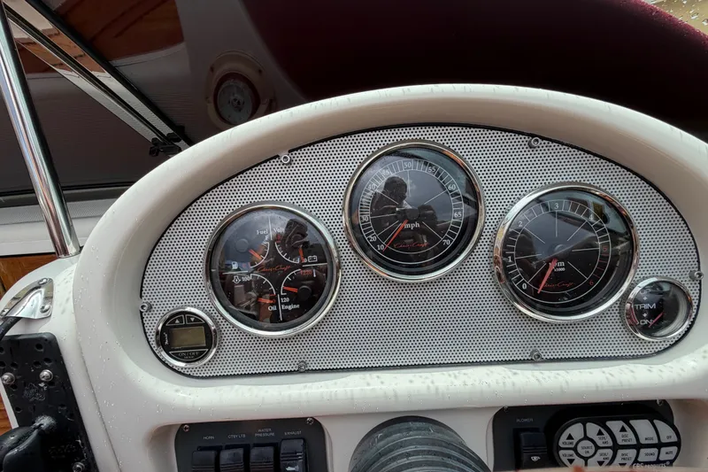 Slide: The Image of Dashboard of a 2005 Chris-Craft Corsair 25 boat with gauges and controls. - 37