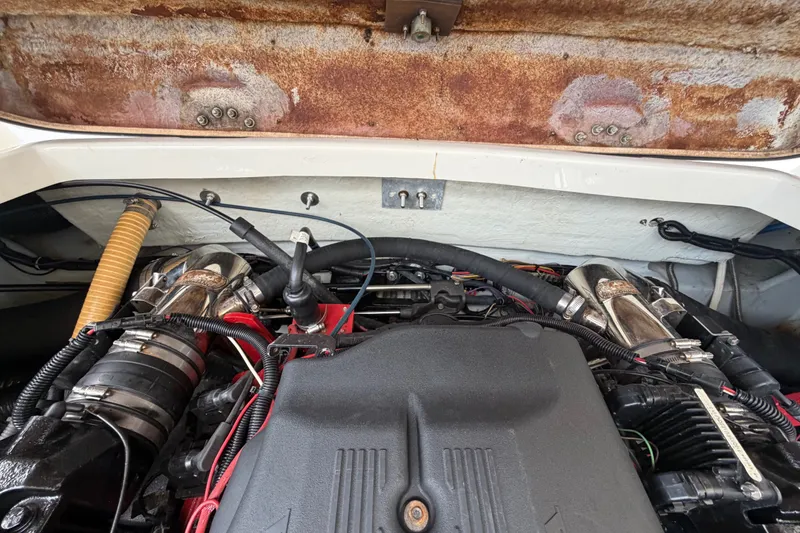 Slide: The Image of Engine compartment of a 2005 Chris-Craft Corsair 25 boat, showcasing mechanical components. - 65