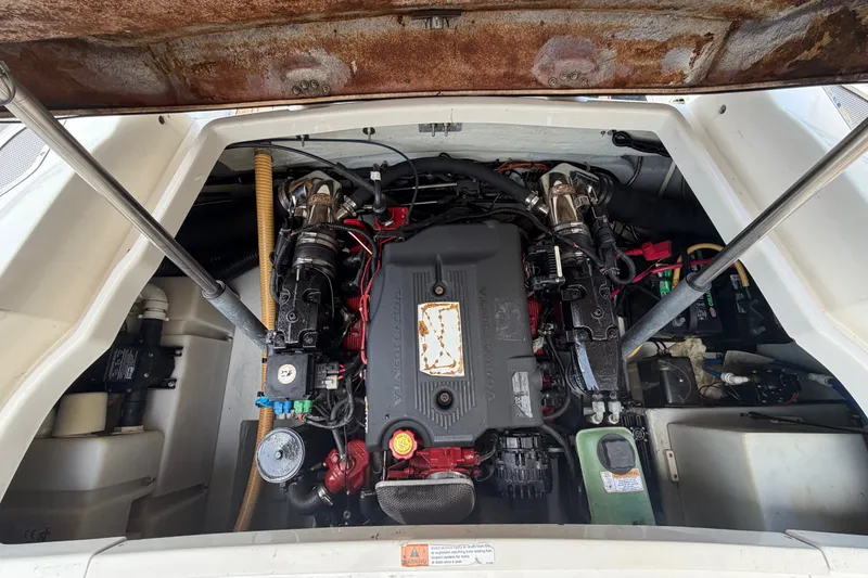 Slide: The Image of Engine compartment of a 2005 Chris-Craft Corsair 25 boat, showcasing detailed mechanics. - 68