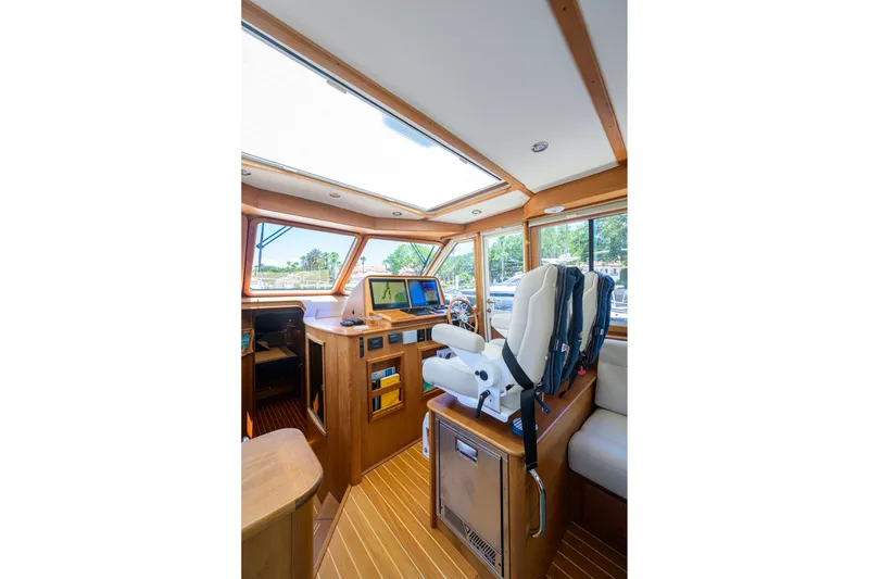 Slide: The Image of Interior of 2018 Sabre 45 Salon Express yacht with helm station and seating. - 45
